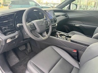 Curbside, this 2026 Lexus RX350h Premium expresses its sophisticated style with a sleek body design... (image 6)