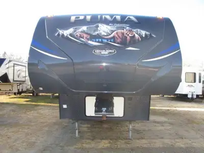 A half ton towable unit with dinette slide , rear kitchen , jack knife sofa , front queen bedroom an...