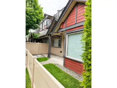 Hard to believe this is a condo and not a townhouse! This ground-level, walk-out corner unit in Ladn...