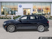 Navigate every journey with confidence and ease in the striking Black 2018 Volkswagen Tiguan Trendli... (image 1)