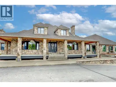 Gorgeous estate home on 10 acres of rolling countryside, ready for your horses and entertaining! Bac...