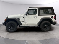 The 2026 Jeep Wrangler Sport 2 Door 4x4, presented in a striking white color, is equipped with a res... (image 1)
