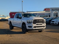 The 2026 Ram 2500 Laramie Crew Cab Night Edition in Bright White combines aggressive style, heavy-du... (image 8)