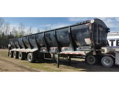 Trailer is a Temisko NOT a Trout River, 48', 4 axle, hydraulic friction drum driven belt, no chains...
