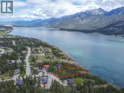 **INCREDIBLY UNIQUE, OVERSIZED 1.67 ACRE BUILDING LOT WITH GORGEOUS LAKE AND MOUNTAIN VIEWS. PRICED...