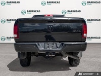 The 2016 Ram 2500 Laramie, finished in an elegant black exterior paired with a sophisticated black i... (image 4)