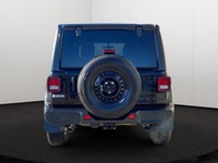 This Jeep Wrangler has a strong Gas/Electric V-6 3.6 L/220 engine powering this Automatic transmissi... (image 4)