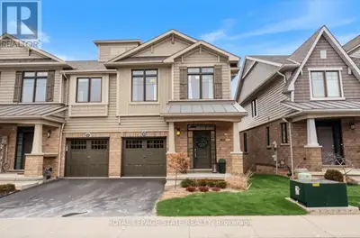 Discover luxury living in this stunning executive end-unit townhome overlooking Lake Ontario. Boasti...