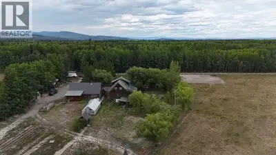 Stunning log home on 153 acres, with approx. 50 acres in hay production. This incredible property in...