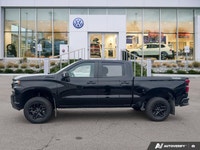 Command the road and beyond in this robust 2021 Chevrolet Silverado 1500 LT Trail Boss. Designed for... (image 1)