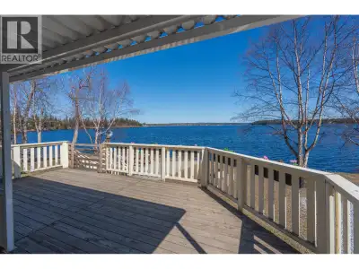 Not many lots like this left on Cluculz Lake! This year-round home sits on 2.65 acres with 130’ of b...
