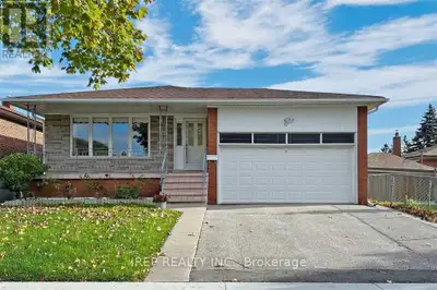 Spacious basement unit in a raised bungalow, featuring large above-grade windows, a separate entranc...
