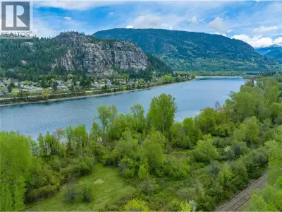 Waterfront Acreage in Castlegar – 13 Acres of Opportunity! Welcome to 1601 Arrow Lakes Drive—an exce...
