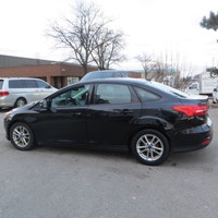 This 2016 Ford Focus SE is a reliable sedan with a sleek black exterior and a stylish charcoal inter... (image 4)