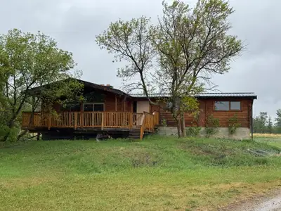 Experience the warmth and charm of country living in this beautiful 3-bedroom, 1-bathroom log cabin,...