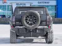 The 2024 GMC HUMMER EV SUV 2X commands attention with an electrified, wide-body stance that blends b... (image 6)