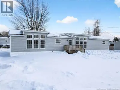 Welcome to 8 Chickadee Street in Pine Tree Village, a beautiful 2022 Maple Leaf mini home offering m...