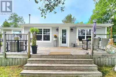 Welcome to 21 MacGillivray Lane, a picture perfect retreat in North Side East Bay overlooking the be...