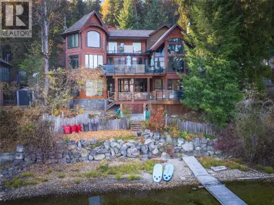 Newly Updated Kitchen! Experience waterfront luxury in this stunning home designed for 2 large famil...