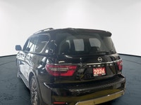 Experience luxury and power in the 2024 Nissan Armada 4x4 Platinum, presented in an eye-catching Bla... (image 3)