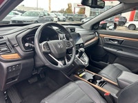 Command the road in the breathtaking Radiant Red Metallic 2021 Honda CR-V Touring, a sophisticated s... (image 9)