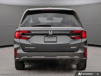 The 2026 Honda Odyssey Touring van in elegant Gray, complemented by a reliable automatic transmissio... (image 4)