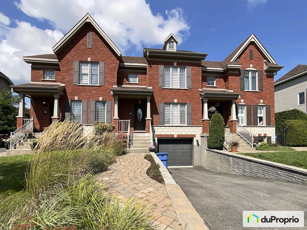 $605,000 - Townhouse for sale in Candiac — photo 1