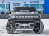 The 2024 GMC HUMMER EV SUV 2X commands attention with an electrified, wide-body stance that blends b... (image 1)