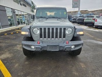 The 2022 Jeep Wrangler Unlimited Rubicon 4x4 in striking Gray awaits you with its robust handling an... (image 7)