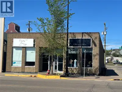 Well-built commercial building on a highly visible corner lot. Two large front units ideal for retai...