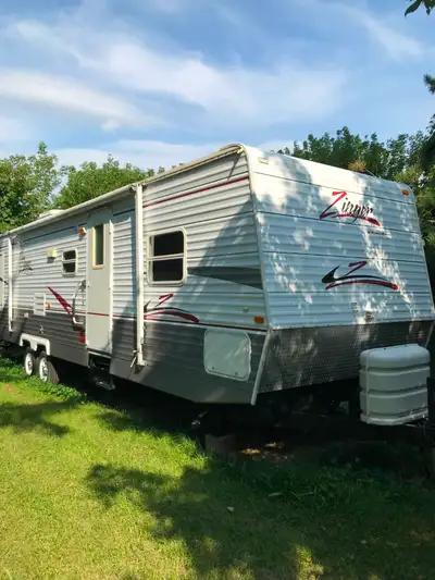 Great Condition -front queen bed and oversized rear bunk beds -dinette converts to bed for additiona...