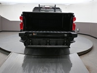 The Custom trim adds 20" black painted aluminum wheels, body-color bumpers and grille bar, and deep-... (image 3)