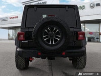 Uncompromising capability meets sophisticated comfort in this 2024 Black Jeep Wrangler Rubicon X Con... (image 4)