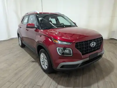 Introducing the vibrant red 2023 Hyundai Venue Preferred with an automatic transmission and front-wh...