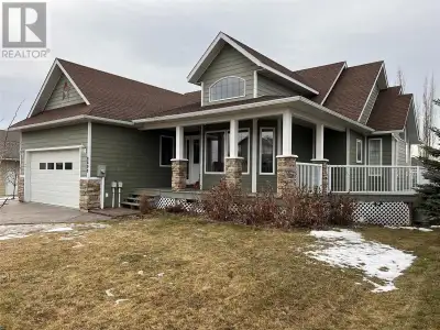 Eye-catching cottage style exterior with a wrap-around veranda & a classy stamped concrete driveway...