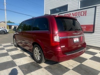 A spacious family minivan with comfortable seating, convenient features, and versatile cargo space,... (image 5)