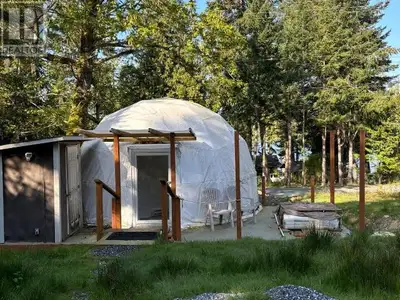 1/3 acre ocean view level lot with 2 year old fabric dome on post a pier footings. Two RV locations...