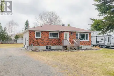Solid brick bungalow situated on a large lot, with a fully renovated upper level that is completely...
