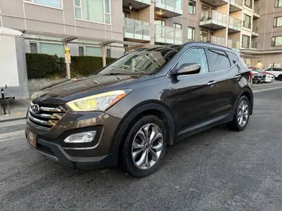 This 2014 Hyundai Santa Fe Limited in elegant Grey is a fully loaded midsize SUV that offers comfort...
