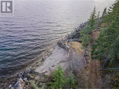 Escape the demands of urban life and embrace the calm of Kootenay Village in Procter, BC. This prime...