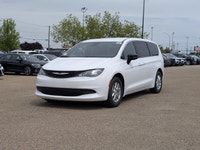 The 2026 Chrysler Grand Caravan SXT in Bright White with a Black interior offers the perfect blend o... (image 1)