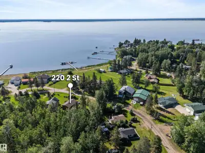 Lake Living with Flexibility Built In Lake Life, All Year Long—on a rare treed double lot in Ross Ha...