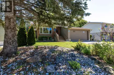 Welcome to this meticulously maintained multi-level back split home, nestled on a beautifully landsc...