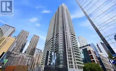 Stunning 3-bedroom, 2-bath corner suite at 300 Front St W featuring floor-to-ceiling windows with pa...
