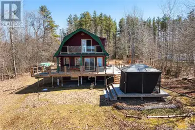 Nestled along the shores of Grand Lake, this waterfront property offers the perfect blend of privacy...