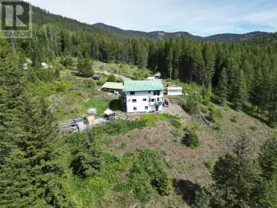 Experience ultimate privacy and breathtaking mountain views on this impressive 20-acre property feat...