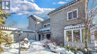 Sitting on a fantastic 1.01 acres in prestigious Woodland Acres, this custom-built estate offers ult...