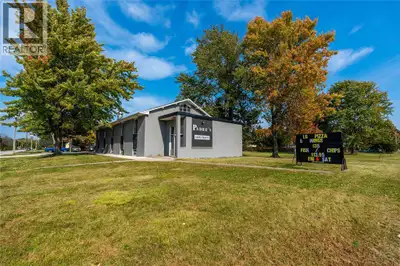 6000 square foot building on a 1/2 acre corner lot. Currently upper level is leased to long-term res...