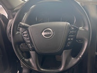 Experience luxury and power in the 2024 Nissan Armada 4x4 Platinum, presented in an eye-catching Bla... (image 6)