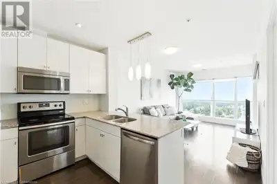 Welcome to Unit 1403 at 1 Victoria Street S – a bright and modern one-bedroom plus den condo in the...